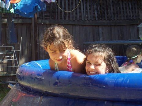 kids playing in inflatable pool